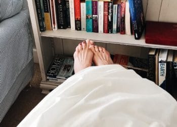 feet hanging off bed